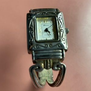 Silver bangle watch